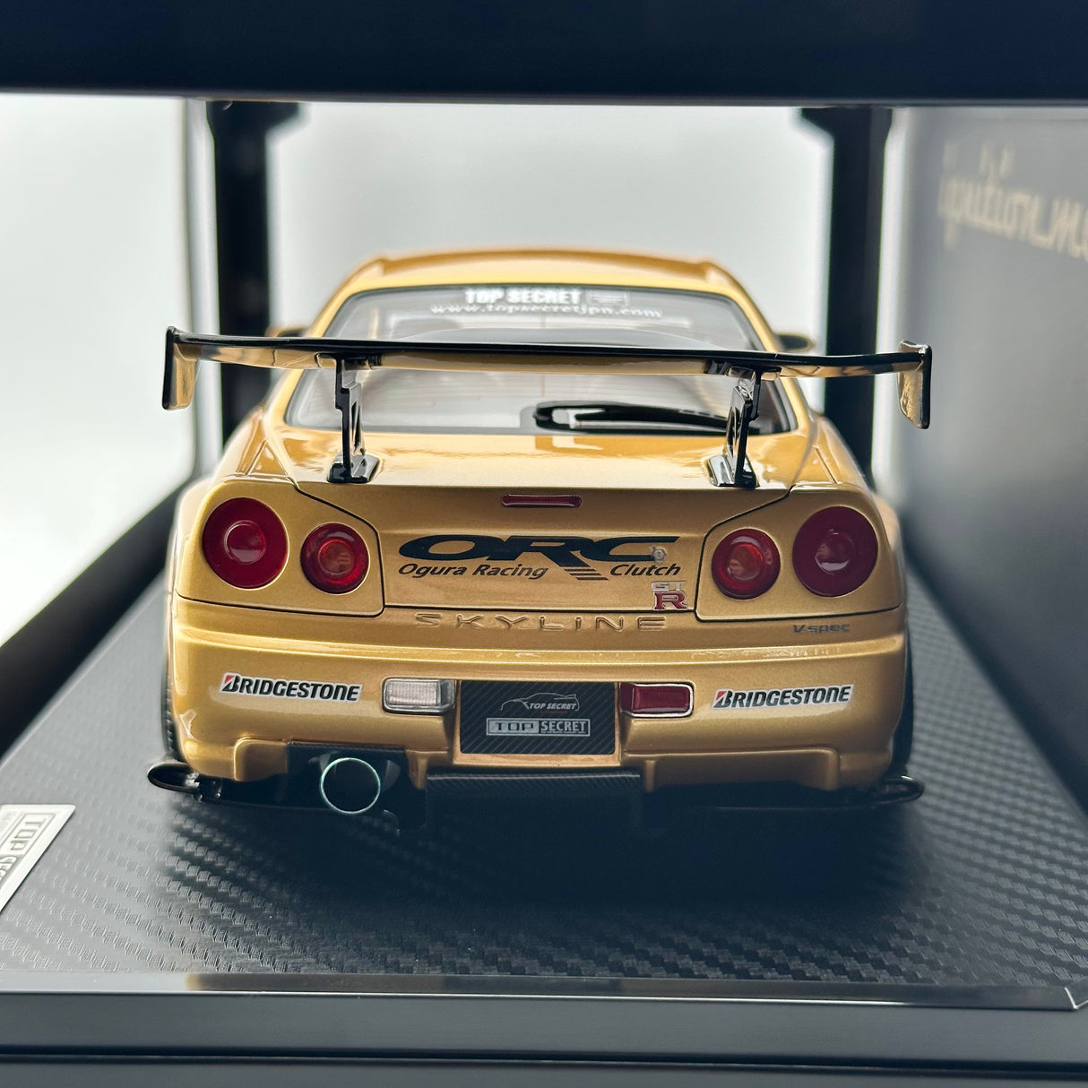 TOP SECRET Nissan Skyline GTR-R34 Gold 1:18 IG3847