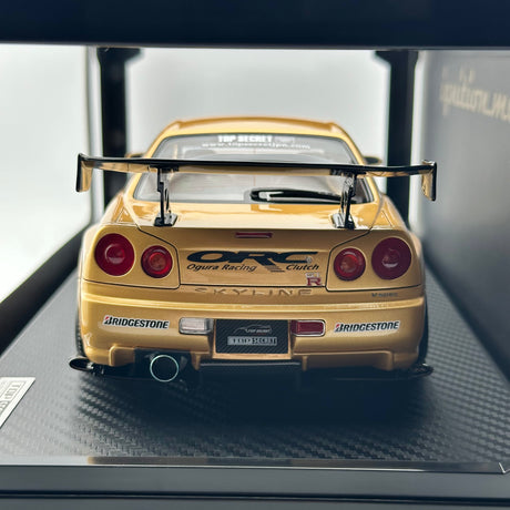 TOP SECRET Nissan Skyline GTR-R34 Gold 1:18 IG3847