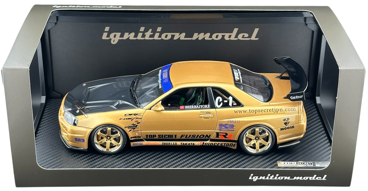 TOP SECRET Nissan Skyline GTR-R34 Gold 1:18 IG3847